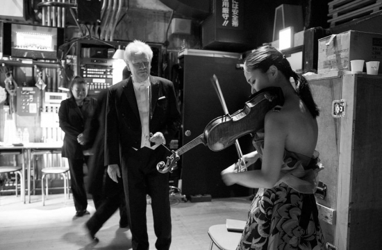 Jiří Bělohlávek and Sayaka Shoji share the last moments before the start of the performance while the audience waits excitedly.